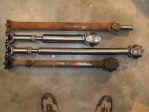 Old shafts vs. new shafts. The rear shaft changes from std. u-joint w/t-case slip to double cardan (CV) style.